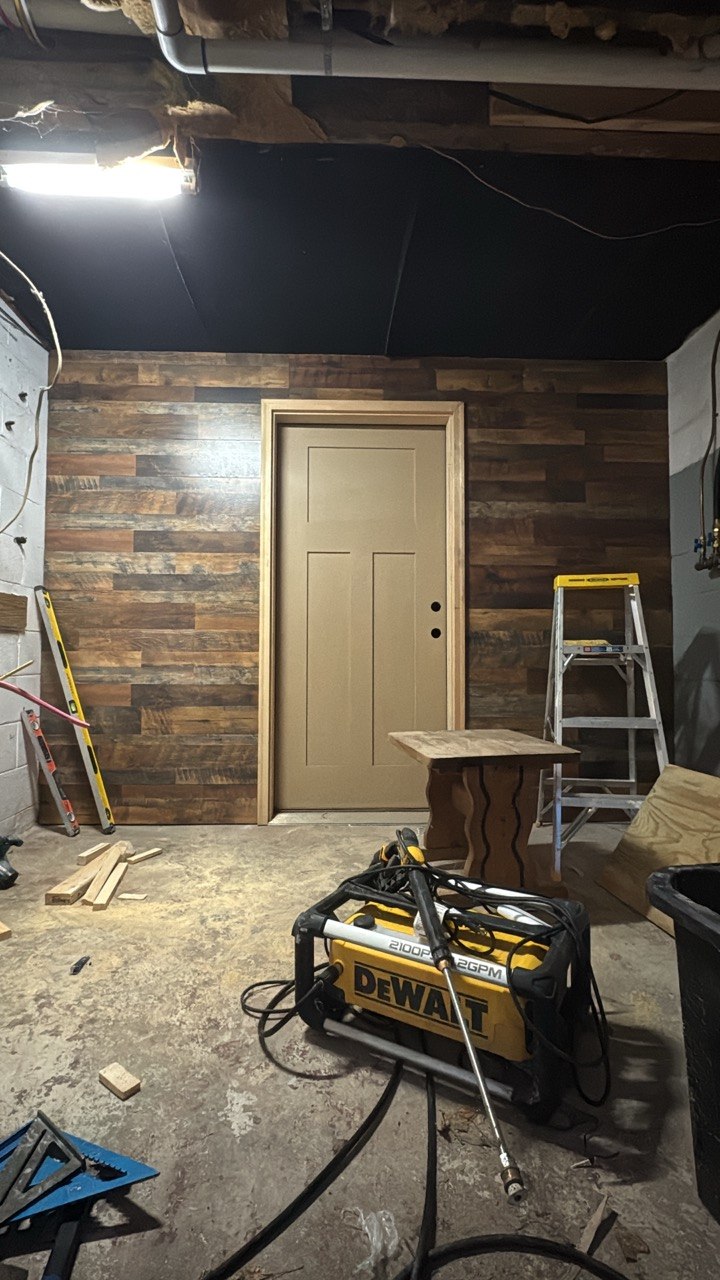 Finished room with wood accent wall