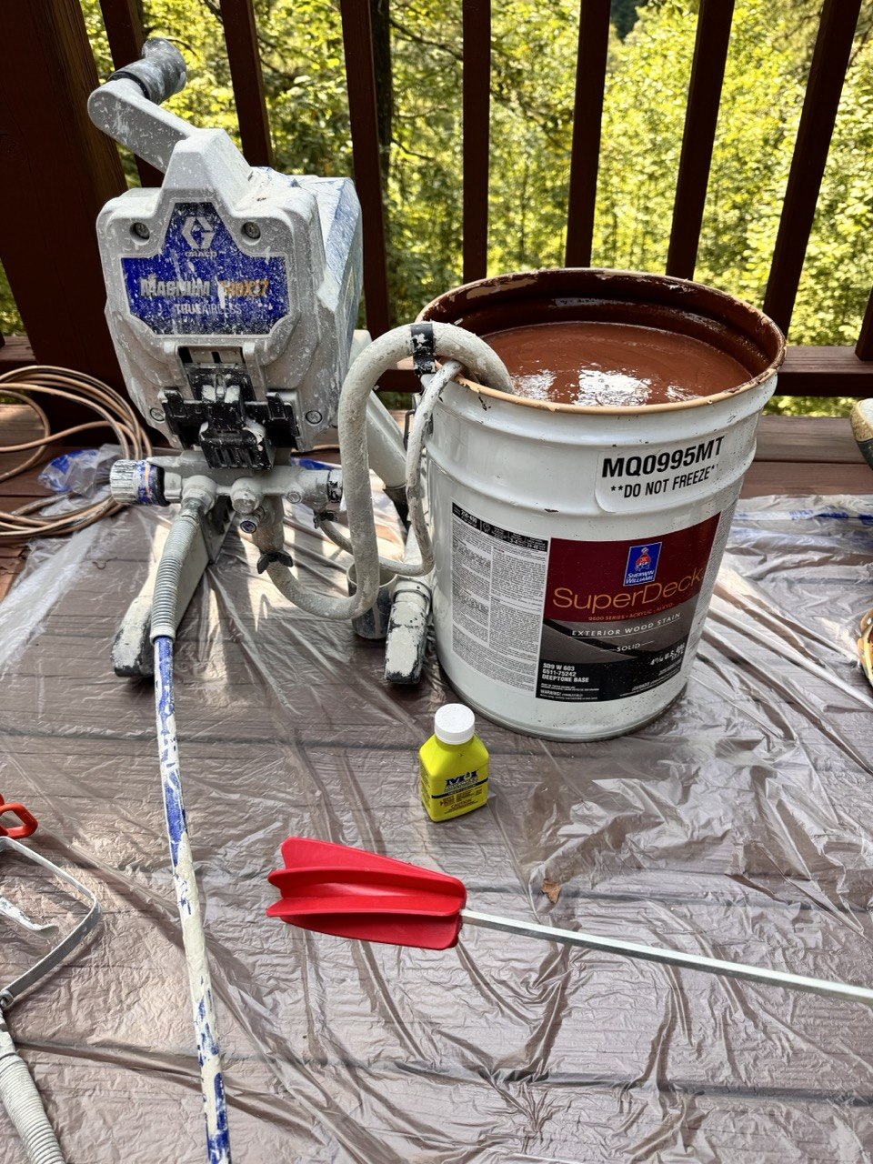 Deck staining with sprayer