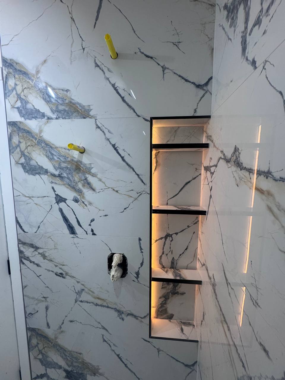 Backlit marble shower niche